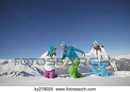 Couple and daughter walking in snow View Large Photo Image Stock Photography - Couple and daughter walking in snow. Fotosearch