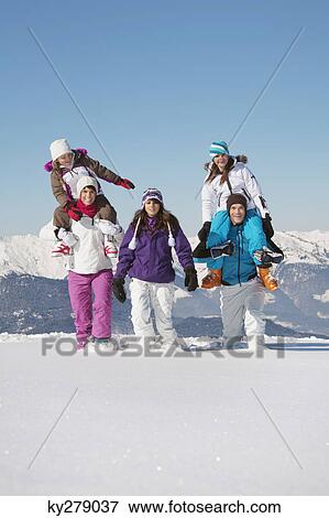 Happy family in snow View Large Photo Image Stock Photo - Happy family in snow. Fotosearch