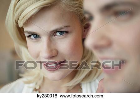 Stock Photo - Close-up of a couple smiling. Fotosearch