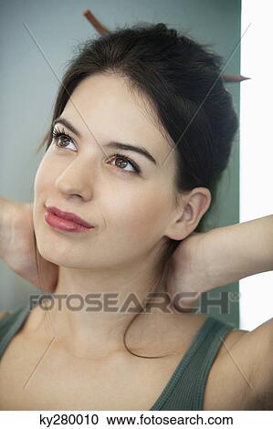 Close-up of a woman day dreaming View Large Photo Image Stock Image - Close-up of a woman day dreaming. Fotosearch