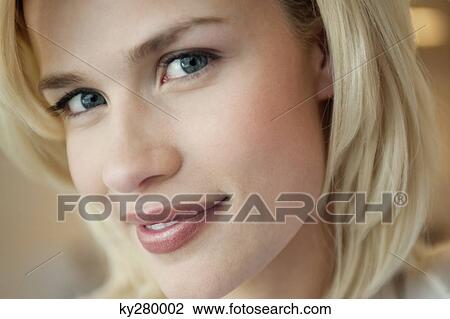 Close-up of a woman smiling View Large Photo Image Stock Image - Close-up of a woman smiling. Fotosearch
