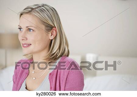 Close-up of a woman smiling View Large Photo Image Stock Photograph - Close-up of a woman smiling. Fotosearch