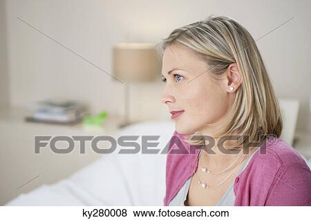 Close-up of a woman thinking View Large Photo Image Stock Photo - Close-up of a woman thinking. Fotosearch