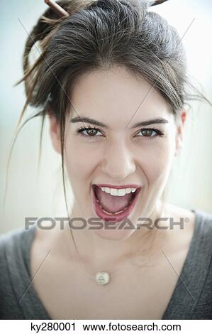 Portrait of a businesswoman shouting View Large Photo Image Stock Image - Portrait of a businesswoman shouting. Fotosearch