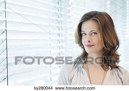 Portrait of a woman smiling View Large Photo Image Picture - Portrait of a woman smiling. Fotosearch
