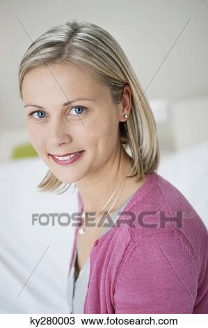 Stock Image - Portrait of a woman smiling. Fotosearch