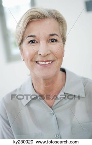 Stock Image - Portrait of a woman smiling. Fotosearch