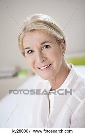 Stock Photo - Portrait of a woman smiling. Fotosearch