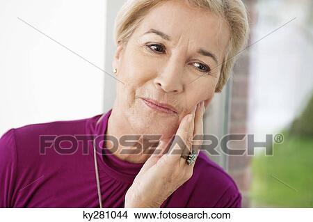 Close-up of a woman suffering from a toothache View Large Photo Image Picture - Close-up of a woman suffering from a toothache. Fotosearch