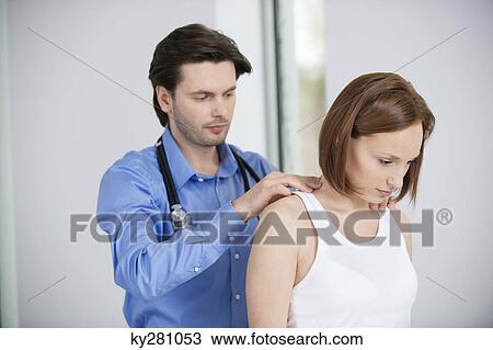 Doctor examining a patient View Large Photo Image Stock Image - Doctor examining a patient. Fotosearch