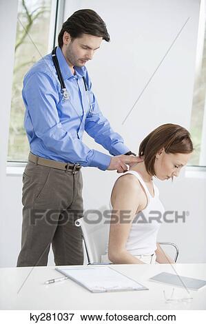 Doctor examining a patient View Large Photo Image Stock Photo - Doctor examining a patient. Fotosearch