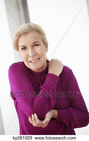 Woman suffering from shoulder pain View Large Photo Image Stock Photo - Woman suffering from shoulder pain. Fotosearch