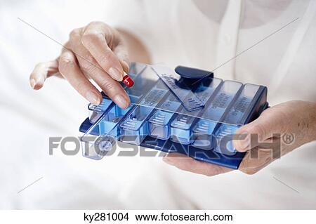 Woman taking a capsule View Large Photo Image Picture - Woman taking a capsule. Fotosearch