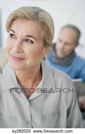 Close-up of a woman smiling View Large Photo Image Stock Image - Close-up of a woman smiling. Fotosearch