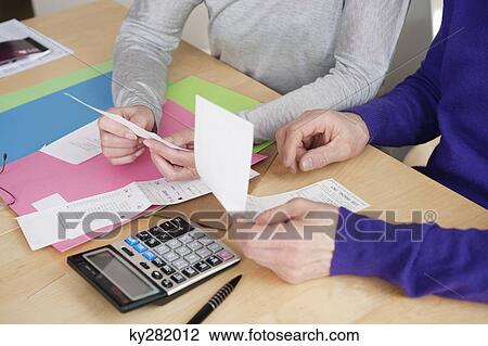 Couple sorting out bills View Large Photo Image Stock Image - Couple sorting out bills. Fotosearch