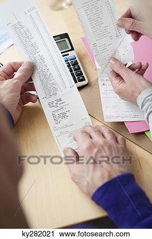 Couple sorting out bills View Large Photo Image Stock Image - Couple sorting out bills. Fotosearch