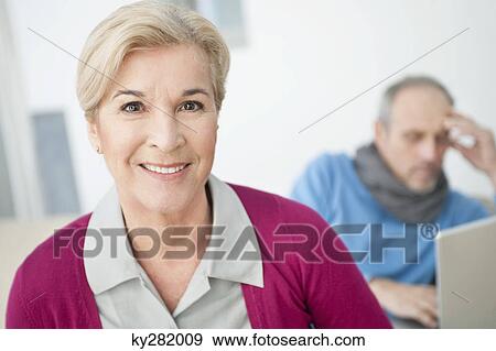 Portrait of a woman smiling View Large Photo Image Stock Photo - Portrait of a woman smiling. Fotosearch