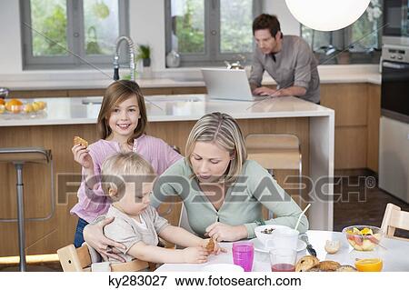 Family at a breakfast table View Large Photo Image Stock Photo - Family at a breakfast table. Fotosearch