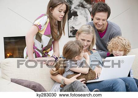 Family using a laptop View Large Photo Image Stock Image - Family using a laptop. Fotosearch