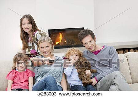 Family watching television View Large Photo Image Stock Image - Family watching television. Fotosearch