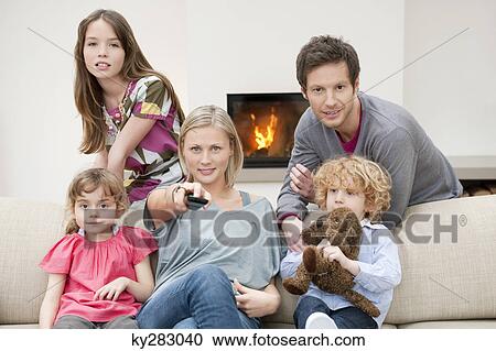 Family watching television View Large Photo Image Stock Image - Family watching television. Fotosearch