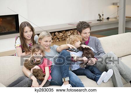 Family watching television View Large Photo Image Stock Photography - Family watching television. Fotosearch