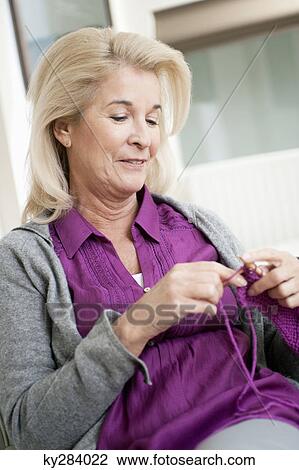 Close-up of a woman knitting View Large Photo Image Stock Image - Close-up of a woman knitting. Fotosearch