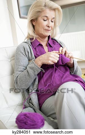 Close-up of a woman knitting View Large Photo Image Stock Image - Close-up of a woman knitting. Fotosearch