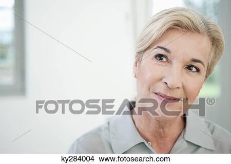Close-up of a woman smiling View Large Photo Image Picture - Close-up of a woman smiling. Fotosearch