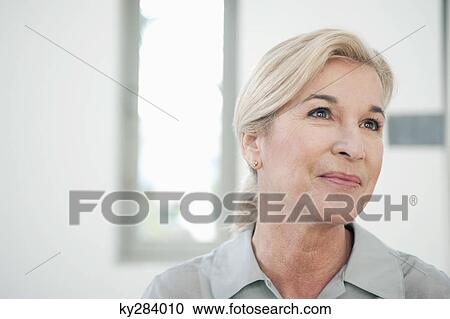Close-up of a woman smiling View Large Photo Image Stock Image - Close-up of a woman smiling. Fotosearch