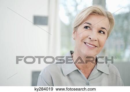 Close-up of a woman smiling View Large Photo Image Stock Photo - Close-up of a woman smiling. Fotosearch