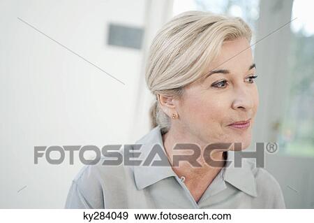 Close-up of a woman smiling View Large Photo Image Stock Photo - Close-up of a woman smiling. Fotosearch