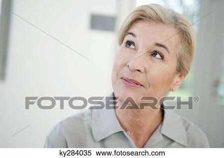 Close-up of a woman smiling View Large Photo Image Stock Photography - Close-up of a woman smiling. Fotosearch