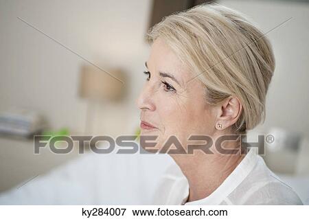 Close-up of a woman thinking View Large Photo Image Stock Photo - Close-up of a woman thinking. Fotosearch