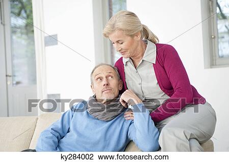 Couple sitting together View Large Photo Image Stock Image - Couple sitting together. Fotosearch