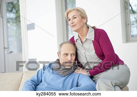 Couple sitting together View Large Photo Image Stock Photography - Couple sitting together. Fotosearch