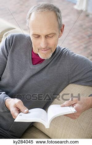 Man reading a book View Large Photo Image Stock Photography - Man reading a book. Fotosearch