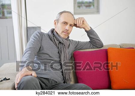 Stock Image - Portrait of a man smirking. Fotosearch