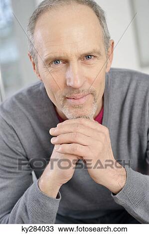Portrait of a man smirking View Large Photo Image Stock Image - Portrait of a man smirking. Fotosearch