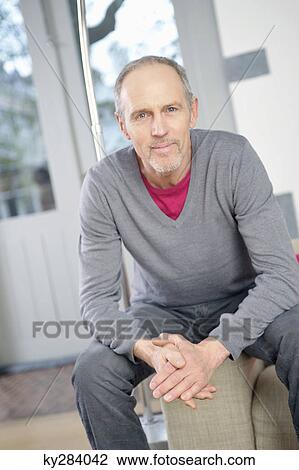 Portrait of a man smirking View Large Photo Image Stock Image - Portrait of a man smirking. Fotosearch