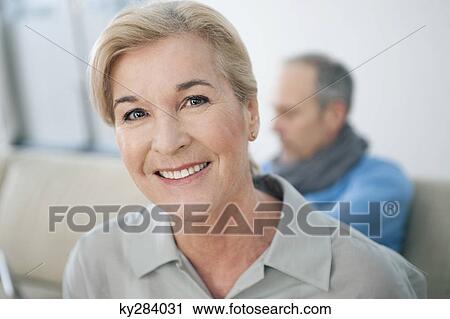 Stock Image - Portrait of a woman smiling. Fotosearch