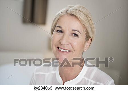 Stock Image - Portrait of a woman smiling. Fotosearch