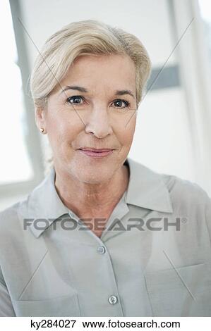 Portrait of a woman smiling View Large Photo Image Stock Photo - Portrait of a woman smiling. Fotosearch