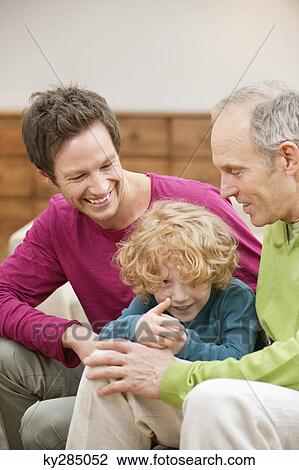 Stock Image - Family smiling together. Fotosearch
