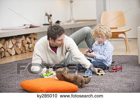 Man playing with his son View Large Photo Image Stock Image - Man playing with his son. Fotosearch