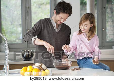 Man stirring a mixture in a bowl with his daughter View Large Photo Image Stock Image - Man stirring a mixture in a bowl with his daughter. Fotosearch