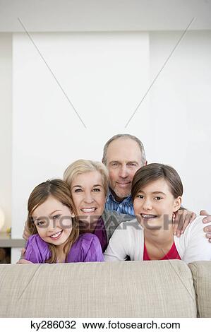 Couple smiling with their granddaughters View Large Photo Image Stock Image - Couple smiling with their granddaughters. Fotosearch