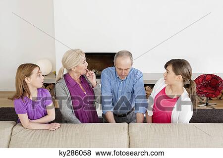 Family in a living room View Large Photo Image Stock Photo - Family in a living room. Fotosearch