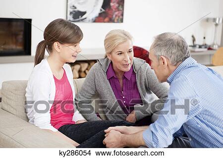 Girl sitting with her grandparents View Large Photo Image Picture - Girl sitting with her grandparents. Fotosearch