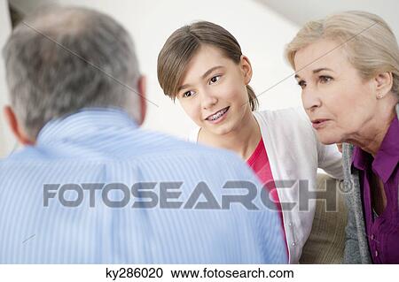 Girl sitting with her grandparents View Large Photo Image Stock Image - Girl sitting with her grandparents. Fotosearch